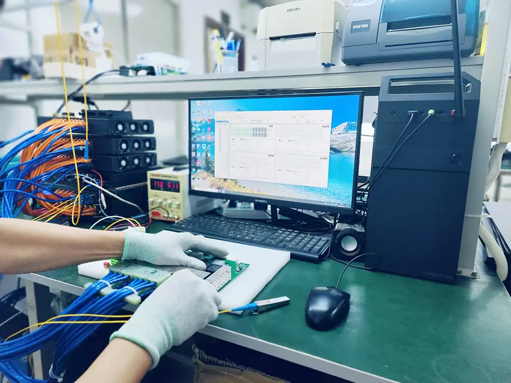 Technician inspecting industrial routers during final quality control