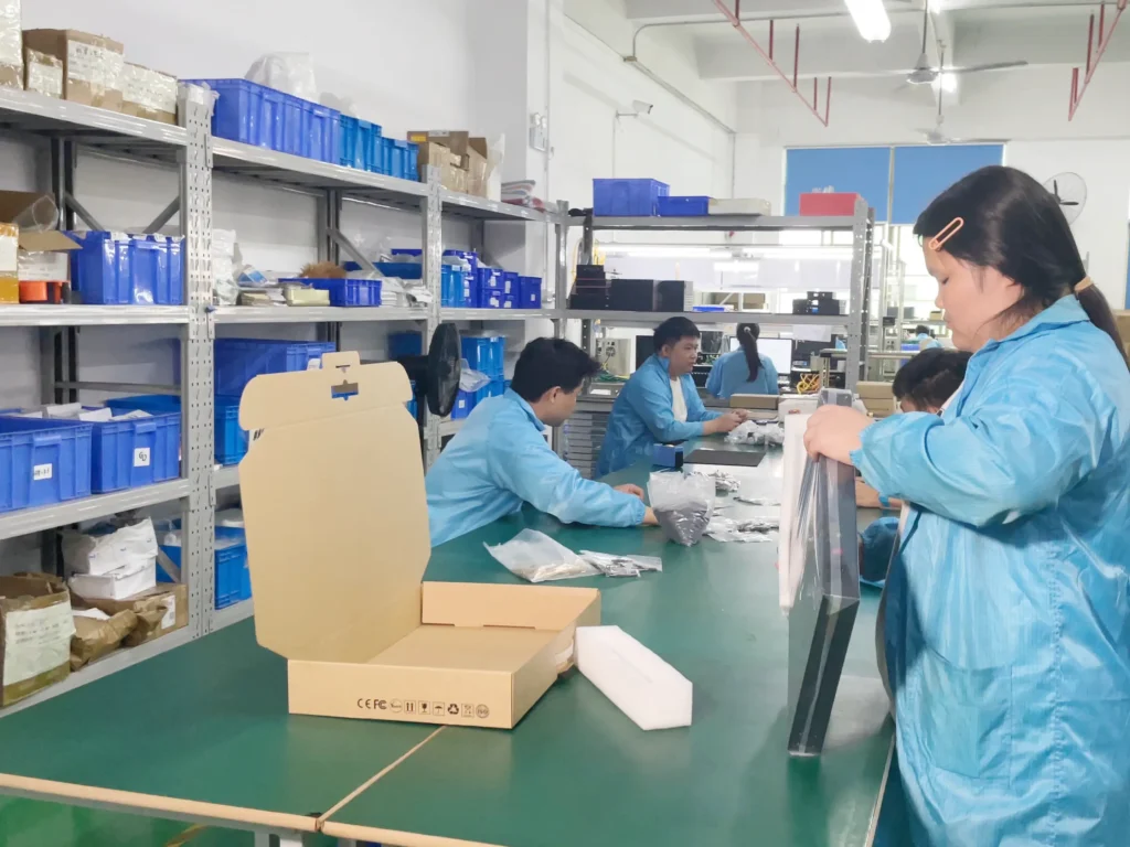 Technician packing industrial routers for safe shipment